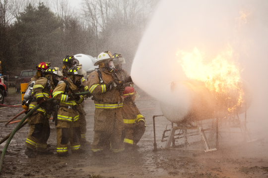 Different approach and fire control. Firefighters learn that by adjusting water patterns for existing conditions and utilizing different approach angles they can successfully move a raging fire off th